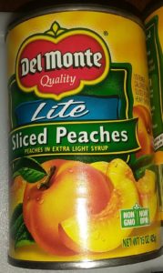 Can of peaches. Summer fruit salad.