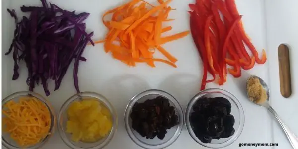 Cut up cabbage, carrots and green peppers. Pineapple Plum Spring Salad