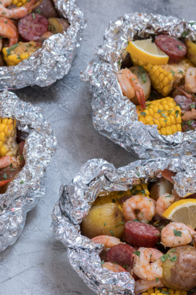 shrimp, corn, and potatoes in foil packets