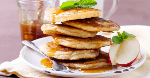 apple pancakes on a plate with syrup