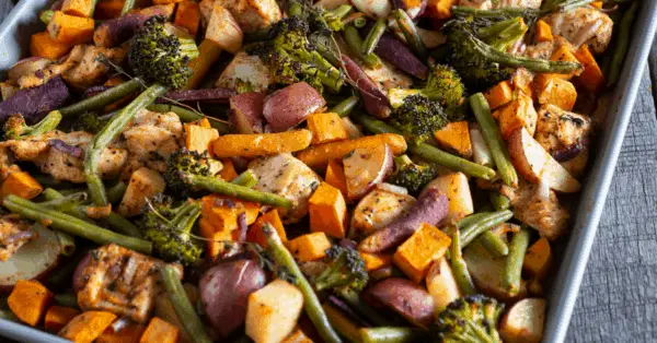 chicken and vegetables on a sheet pan