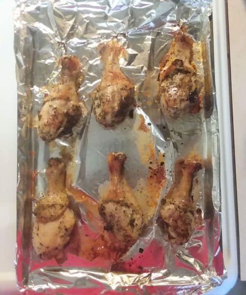 chicken drumsticks on a baking sheet
