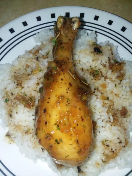chicken drumsticks over rice