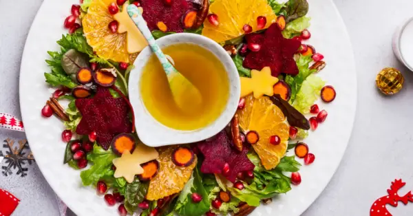 Green salad with pistachios, pomegranate, oranges, and a champagne vinaigrette