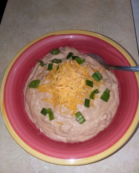 refried beans with cheese and green onions