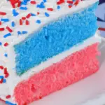 blue and pink cake with white sprinkled icing