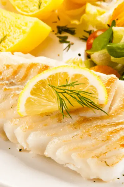 cod on a plate with lemon 