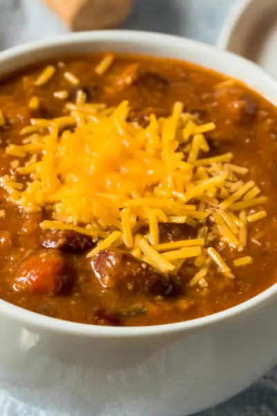 chili in a bowl with cheese on top