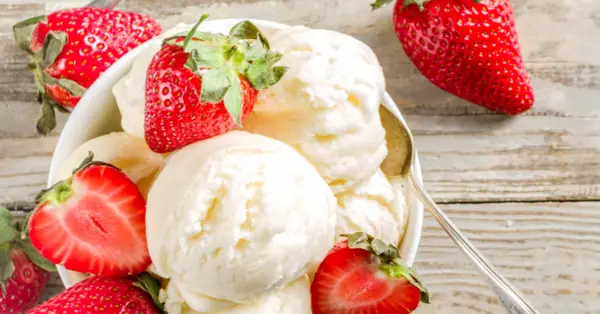vanilla ice cream in the bowl with strawberries