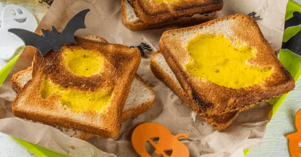 toast with cutout shapes with eggs inside